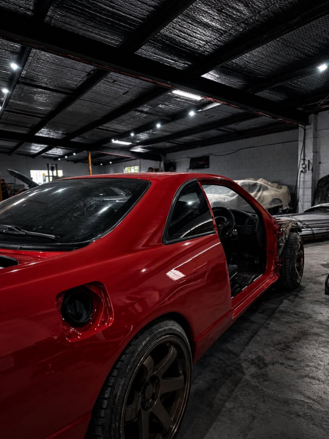 Red coupe — bodywork in progress