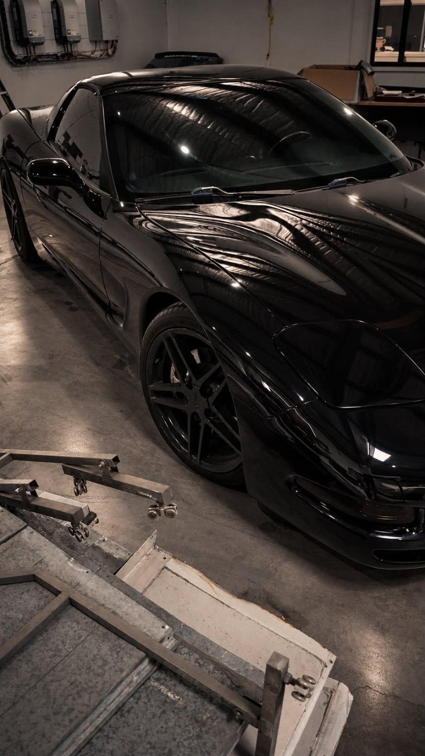 Black sports car — workshop detail