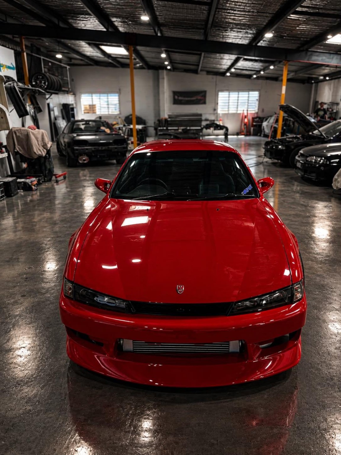 Red coupe — front view