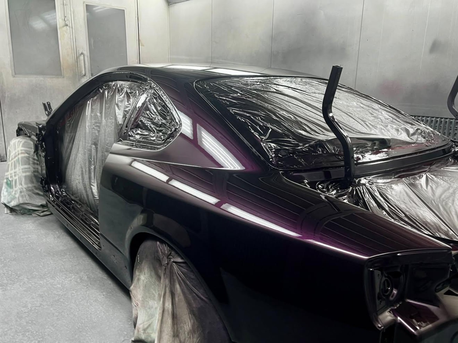 Purple coupe — fresh paint in the booth